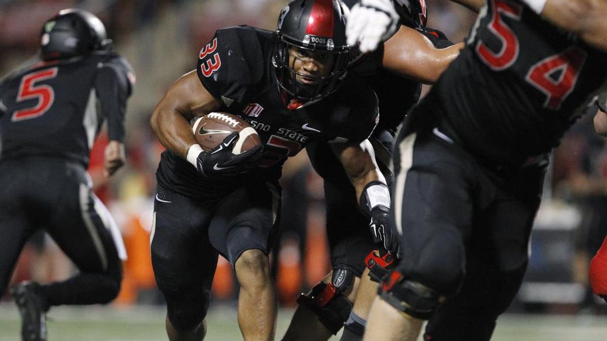 
Fresno State’s Marteze Waller heads into the line against Utah during the second half Saturday, Sept. 19, 2015. The Bulldogs lost 45-24, one of 21 straight losses by Mountain West teams against FBS opposition.
