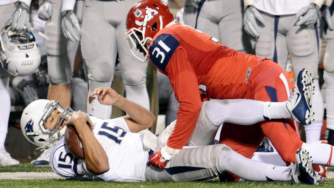 Fresno State’s Ejiro Ederaine, right, pulls down Nevada quarterback Tyler Stewart after a run during their game at Bulldog Stadium on Nov. 5. Ederaine hopes to impress NFL scouts on Fresno State Pro Day on Wednesday.