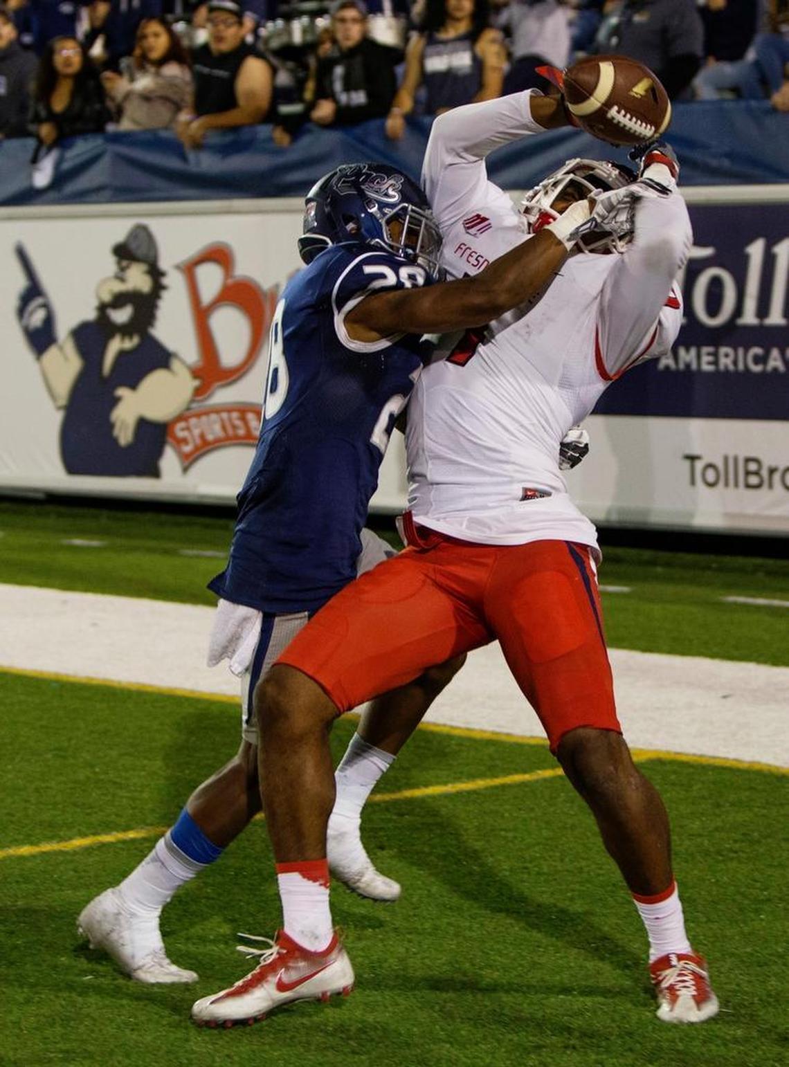 Nevada’s Elijah Mitchell breaks up a pass to Fresno State’s Aaron Peck in the fourth quarter of an NCAA college football game in Reno, Nev., Saturday, Oct. 8, 2016.