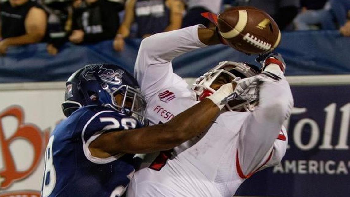Nevada’s Elijah Mitchell breaks up a pass to Fresno State’s Aaron Peck in the fourth quarter of an NCAA college football game in Reno, Nev., Saturday, Oct. 8, 2016.