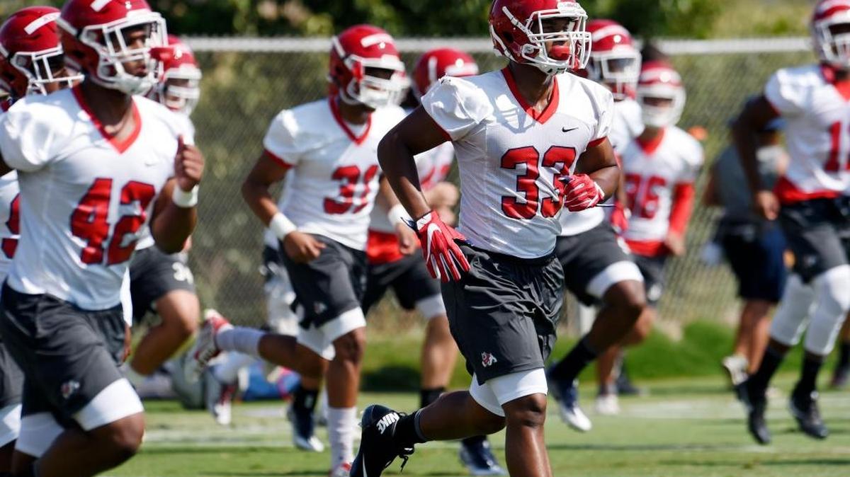 Fresno State defensive end Kwami Jones, center, works out with others as Fresno State begins fall football practice Aug. 1, 2017 in Fresno.