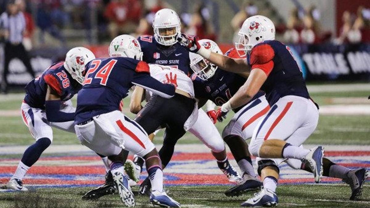 Fresno State linebacker James Bailey (24) makes a tackle in his first career start against UNLV on Oct. 16, 2015. He finished with seven total in the game, including three solo, as the Bulldogs beat the Rebels 31-28.