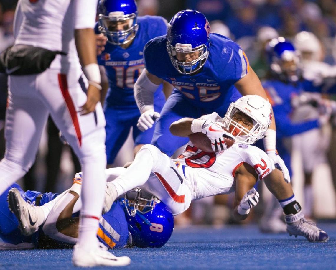 Fresno State running back Ronnie Rivers (20) is tackeled by Boise State defensive end Jabril Frazier (8) in the Broncos’ 17-14 victory over the Bulldogs in the Mountain West Conference Championship Saturday, Dec. 2, 2017 at Albertsons Stadium in Boise. Fresno State rushed for 137 yards on 35 plays, just 3.9 yards per play.