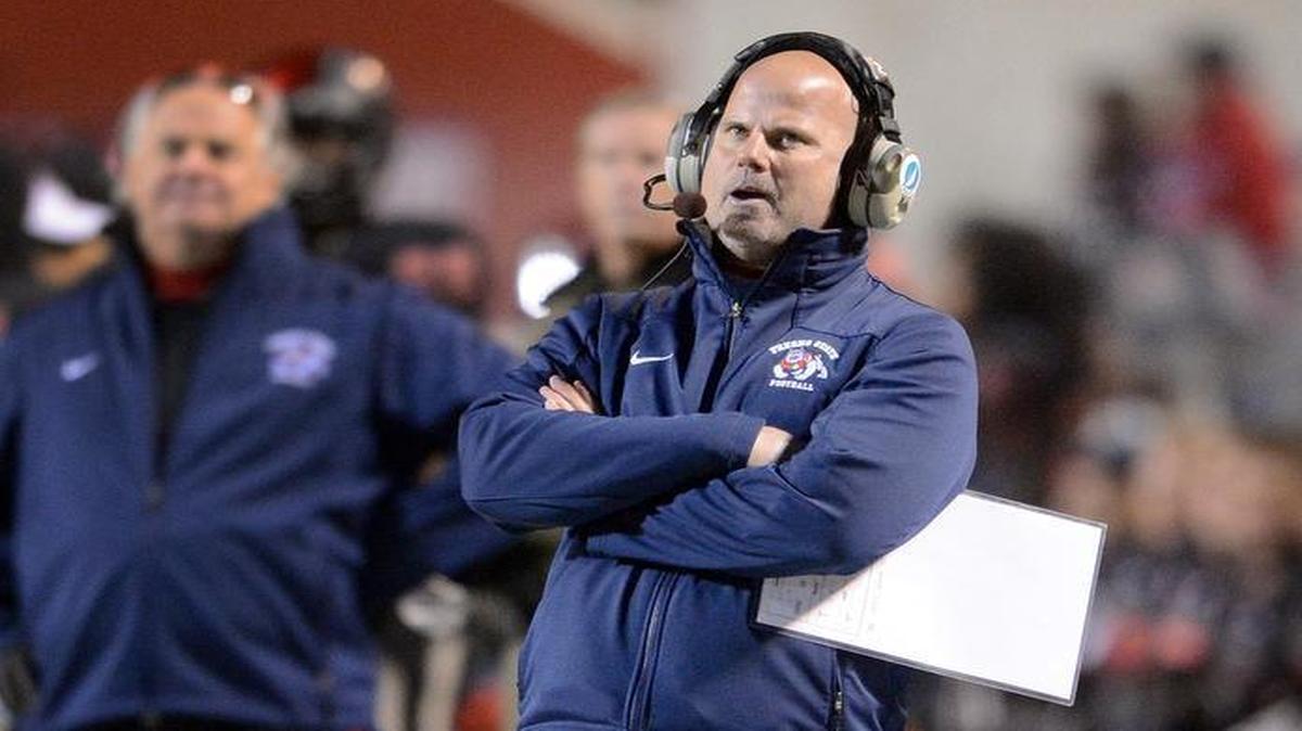 
Fresno State offensive coordinator Dave Schramm keeps tabs on the progress of the Bulldogs during the Mountain West Conference championship game against Utah State at Bulldog Stadium on Dec. 7, 2013.
