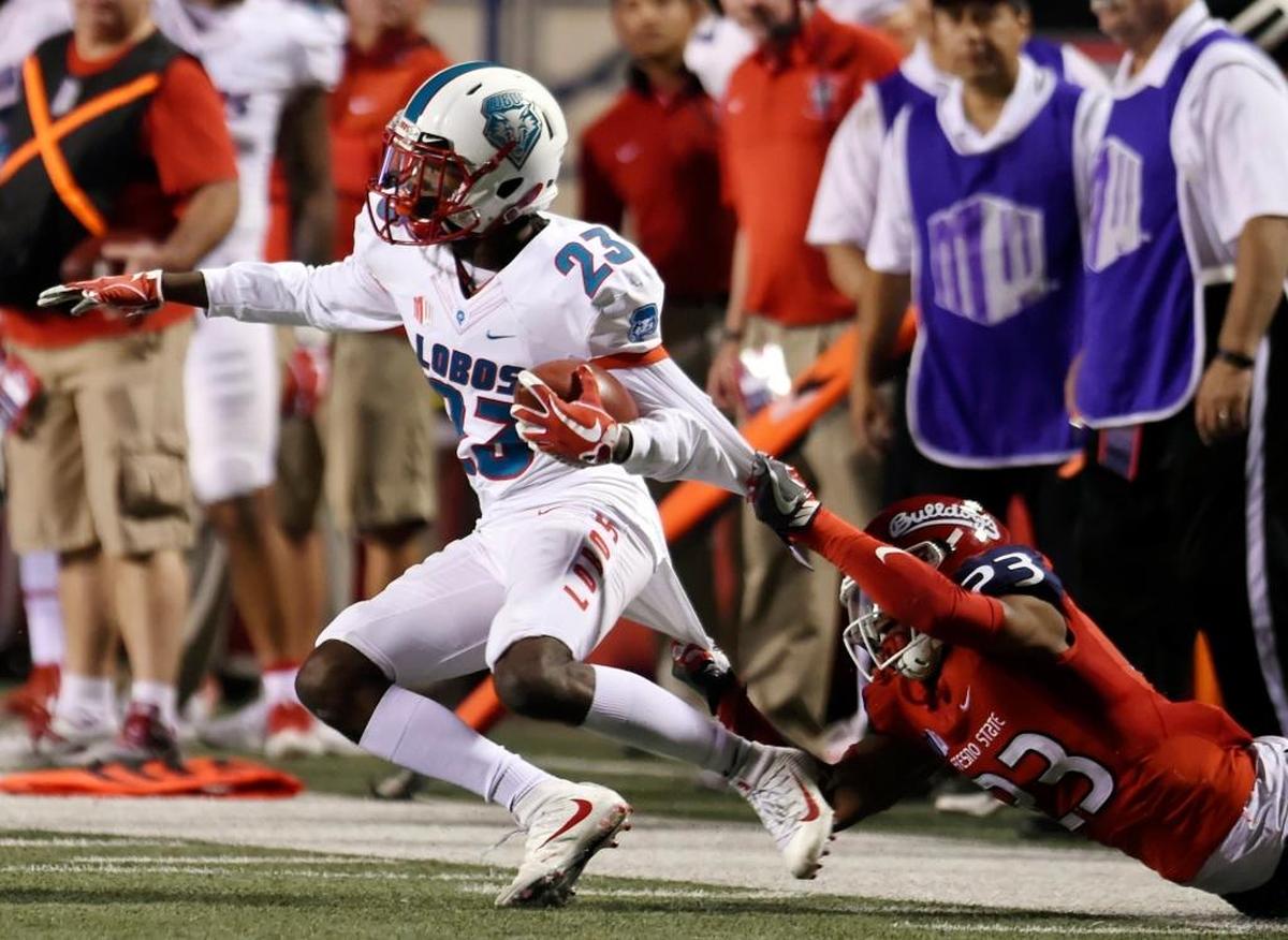 Fresno State safety Juju Hughes pulls down New Mexico’s Jay Griffin IV, left, in the first half of the Bulldogs’ 38-0 victory over the Lobos Saturday, Oct. 14, 2017 in Fresno. Hughes, the defensive player of the week after the Bulldogs’ victory at San Jose State, had another big game. The sophomore from Hanford racked up a team-high 11 tackles including nine solo stops and two tackles for loss. He also broke up two passes for a Bulldogs’ defense that limited one of the top rushing offenses (at 266.8 yards per game) to just 109 rushing yards and 322 total yards.