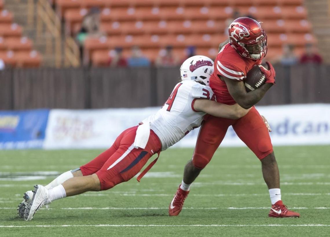 Fresno State linebacker George Helmuth wraps up Houston running back Duke Catalon in the Bulldogs’ Hawaii Bowl victory. Helmuth is one of seven starters returning on a Fresno State defense that last season ranked 10th in the nation in scoring defense.