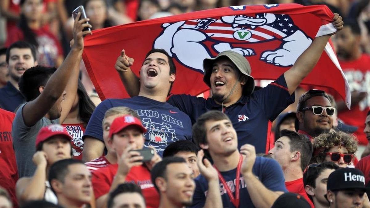 
Fresno State fans take selfies before their Bulldogs take on Abilene Christian in Thursday’s season opener at Bulldog Stadium.
