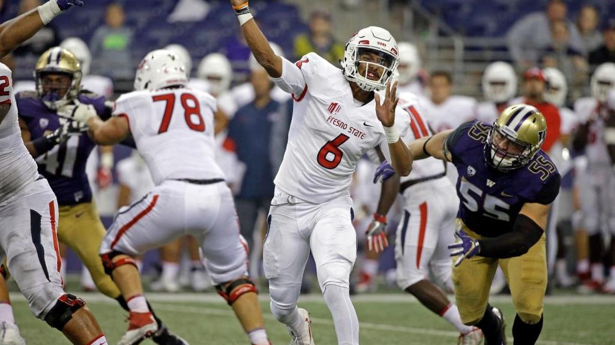 Fresno State quarterback Marcus McMaryion fires a pass against Washington during the second half of an NCAA college football game Saturday, Sept. 16, 2017, in Seattle. McMaryion, who replaced starter Chason Virgil at the start of the third quarter, completed 10 of 16 passes for 96 yards with no touchdowns or interceptions. Washington won 48-16.