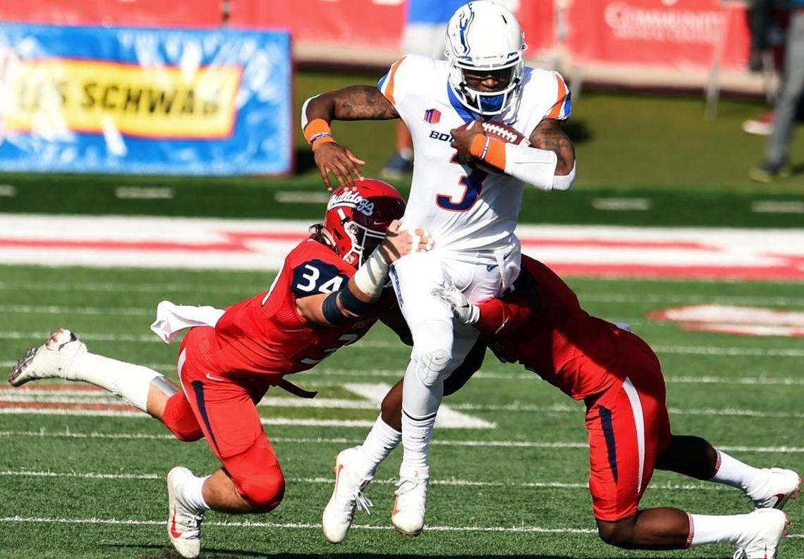 Fresno State linebacker George Heelmuth (34) and cornerback Tank Kelly bring down Boise State quarterback Montell Cozart during the first half of a 28-17 victory Saturday, Nov. 25, 2017. The Bulldogs held Boise State to a season low in points. The Broncos came in averaging 46.3 points over their past four games.