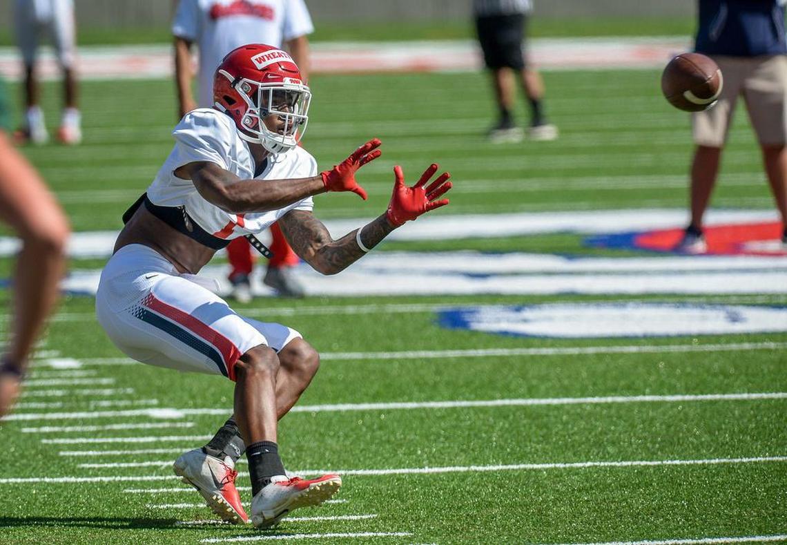 Fresno State wide receiver Keric Wheatfall turns to catch the ball during drills at fall camp on Saturday, Aug. 10, 2019.