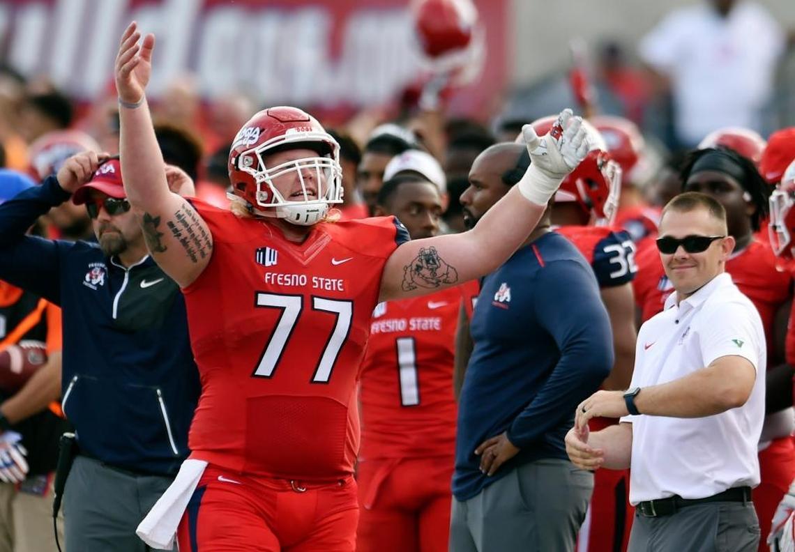 Fresno State center Aaron Mitchell pumps up the crowd during the second half of the Bulldogs’ 28-17 victory over Boise State on Saturday, Nov. 25, 2017. Mitchell and the rest of the offensive line allowed no sacks and just one tackle for loss against a defense that was first sacks and fourth in those categories in the Mountain West.