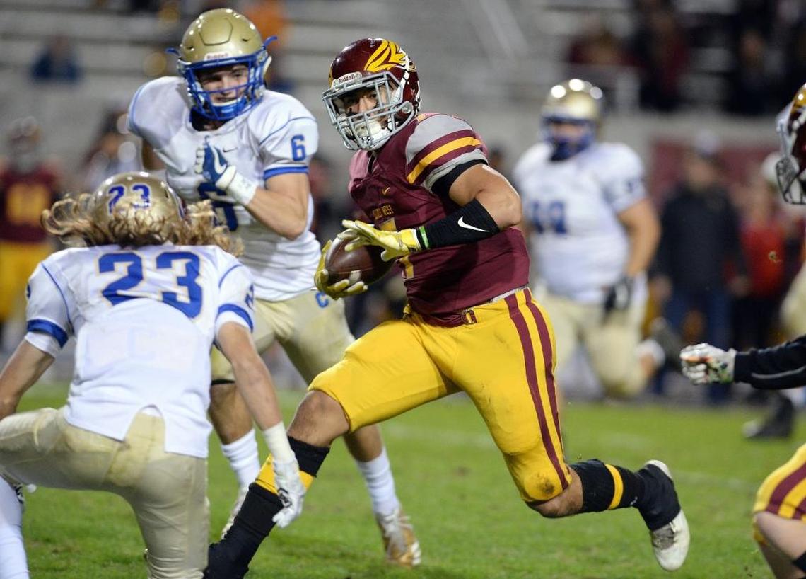 Clovis West wideout Ricardo Arias makes his way down the field against Clovis during their Central Section Division I quarterfinal playoff game at Veterans Memoral Stadium on Friday, Nov. 17, 2017.