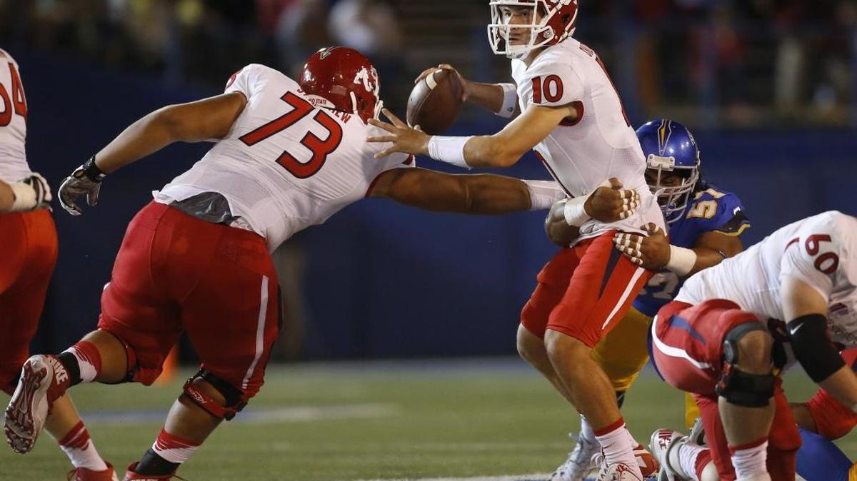 
San Jose State’s Nate Falo gets a grip on Fresno State quarterback Ford Childress during the second quarter of the teams’ Mountain West Conference game Sept. 26, 2015. Childress got his first start since 2013, when he was at West Virginia, but despite a pair of touchdown passes wound up on the losing end 49-23.
