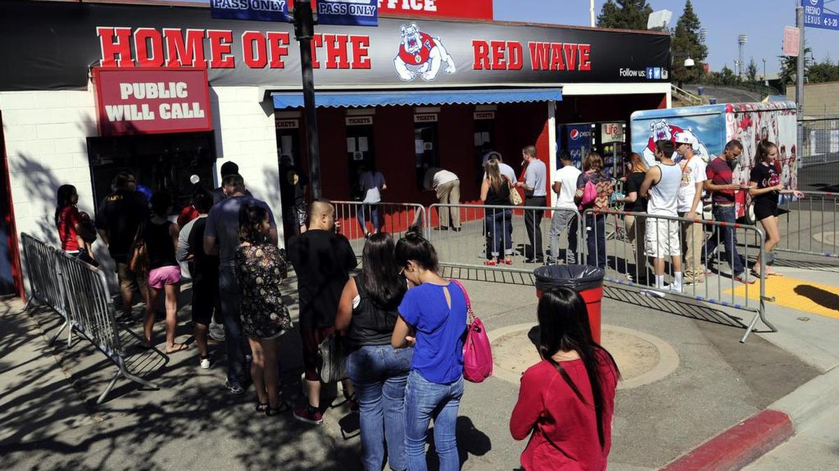
Fresno State football fans line up outside Bulldog Stadium to purchase tickets for the 2013 game against Boise State. Through Wednesday, Aug. 5, 2015, Fresno State had sold 19,030 season tickets for a six-game home slate that includes games against Utah from the Pac-12 and Mountain West Conference rivals Utah State, UNLV, Nevada and Colorado State.
