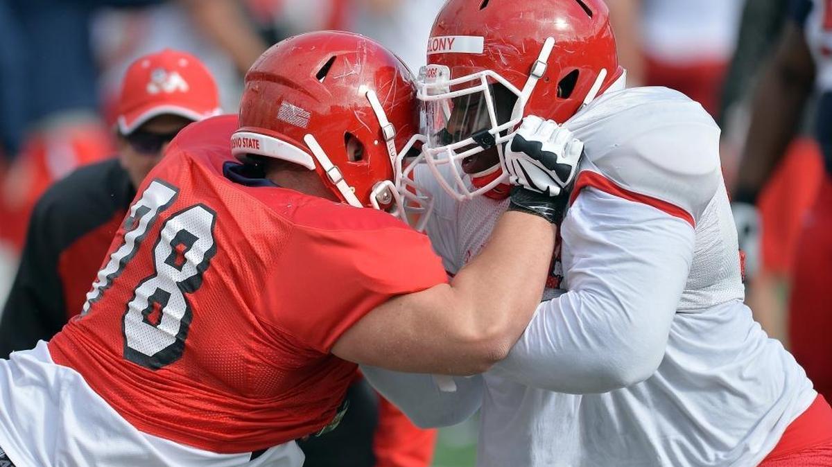 Fresno State’s David Patterson, left, blocks nose guard Patrick Belony during warm-ups before one of the Bulldogs’ 2016 spring scrimmages. Patterson’s emergence at right tackle is one of several positive signs the coaching staff has seen along the offensive line this spring.