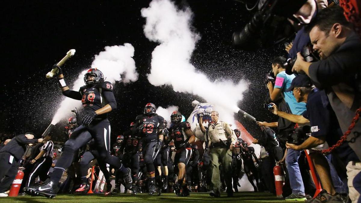 
Fresno State heads out of the tunnel to face Nevada on Nov. 2, 2013. The Bulldogs will wear all-black uniforms again on Sept. 19, 2015, when they host Utah of the Pac-12 at Bulldog Stadium
