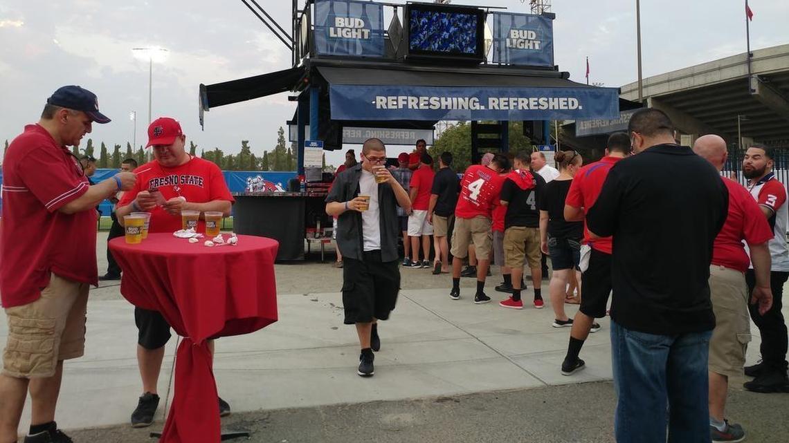 Fans line up for an $8 beer at one of two beer gardens set up within the boundary of Bulldog Stadium during the 2017 opener. Fresno State was able to sell alcohol in the stadium for the first time since 2006, an annual boost of more than $100,000 to the Bulldogs’ athletics department.