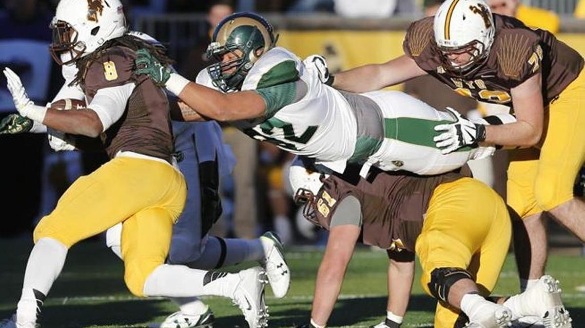 Colorado State defensive tackle and former Clovis North star Josh Lovingood beats two blockers to make a stop on Wyoming running back Brian Hill. Lovingood has 15 tackles on the season and a fumble recovery. The Rams visit Fresno State on Saturday.