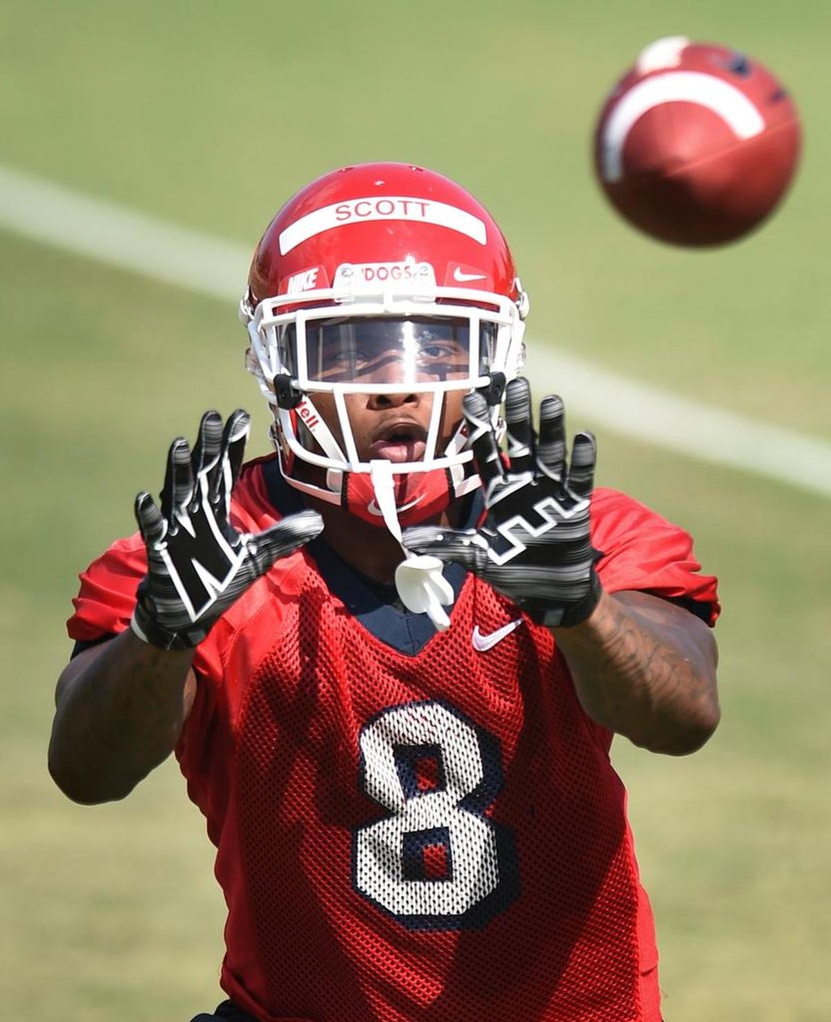 Fresno State wide receiver Da’Mari Scott makes a catch during drills as the Bulldogs begin fall football practice Aug. 1, 2017 in Fresno.