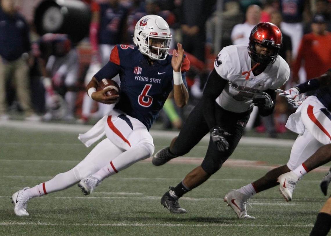 Fresno State quarterback Marcus McMaryion runs by UNLV’s Brian Keyes during the first half of the Bulldogs’ 26-16 loss Saturday, Oct. 28, 2017. McMaryion completed 16 of 27 passes for 152 yards and rushed for 39 yards on nine plays.