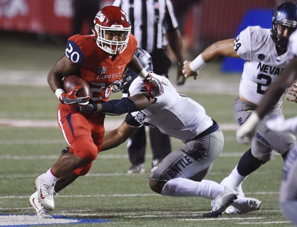 Fresno State freshman Ronnie Rivers runs through a tackle by Nevada’s Asauni Rufus in the Bulldogs’ 41-21 Sept. 30 victory. Rivers is the first freshman running back at Fresno State to start a season-opener going back through 1980.