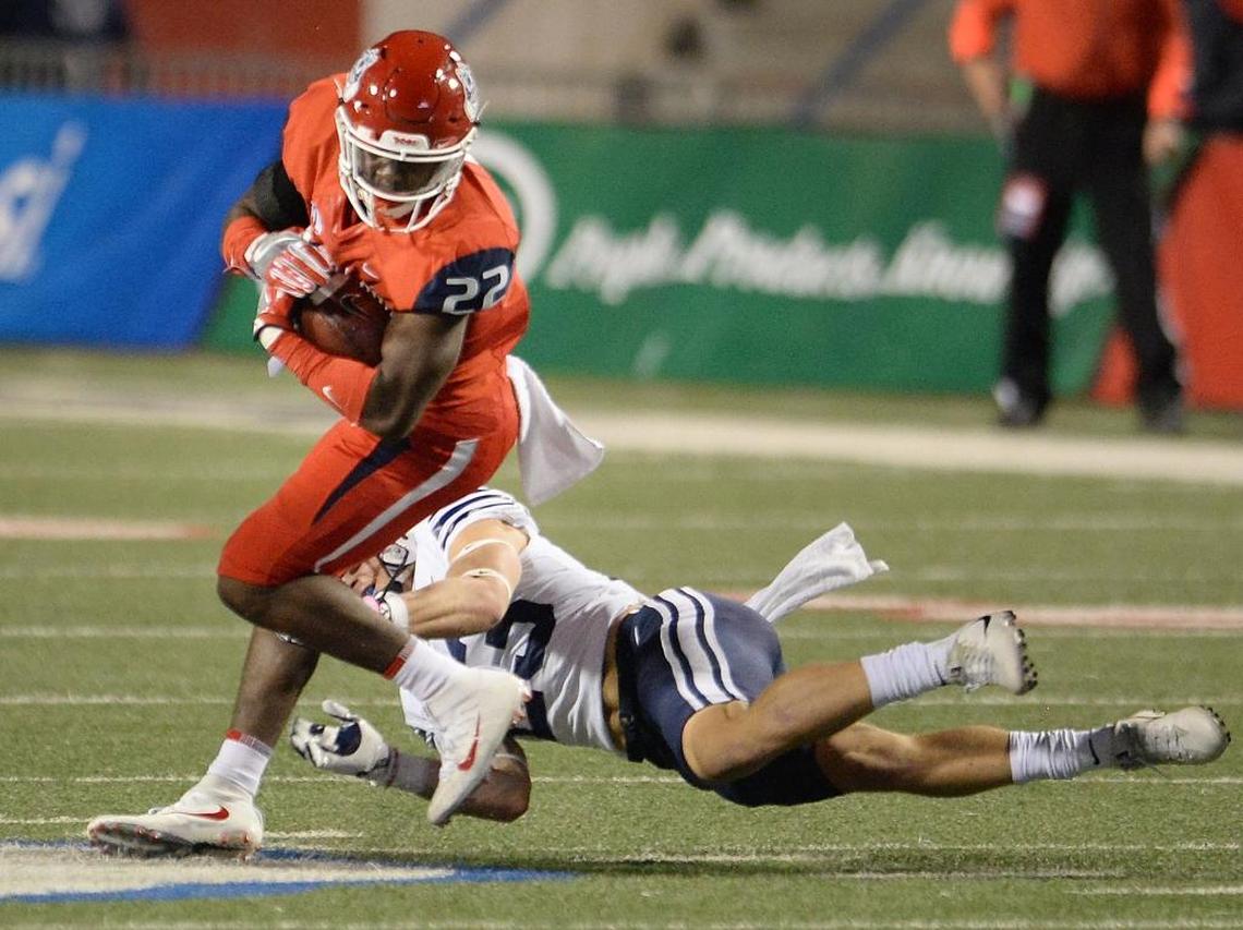Fresno State running back Jordan Mims, left, gets tackled by BYU’s Zayne Anderson on a run play in the first half of the Bulldogs’ 20-13 victory at Bulldog Stadium on Saturday, Nov. 4, 2017. Mims is leading Fresno State in rushing with 457 yards on 101 plays (4.5 ypp) and has scored five touchdowns.