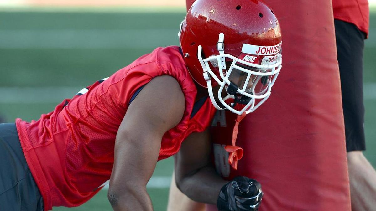 Fresno State wide receiver KeeSean Johnson runs through drills on the first day of spring practice Monday. Johnson, who has 103 receptions in his first two seasons with the Bulldogs, is a more physical receiver this spring after adding 14 pounds of muscle through offseason workouts.