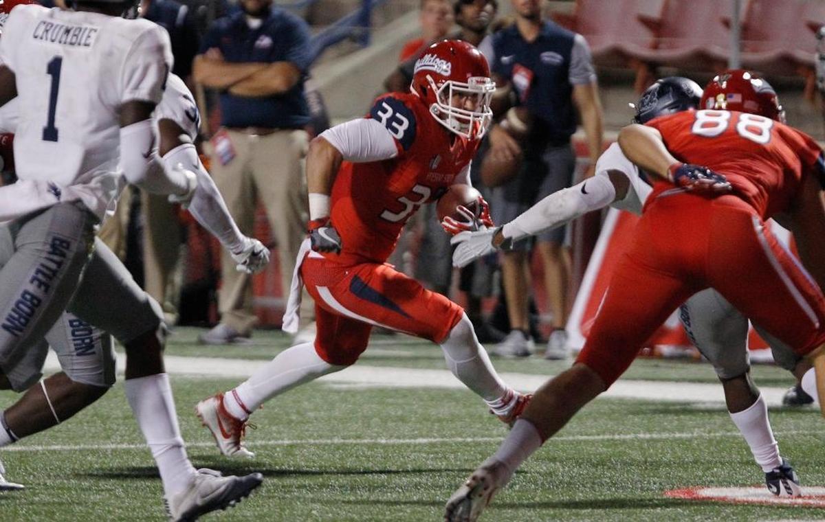 Fresno State running back Josh Hokit makes a cut behind a block by tight end David Tangipa in a 41-21 victory over Nevada last season. Hokit is averaging 4.3 yards per rush for the Bulldogs.