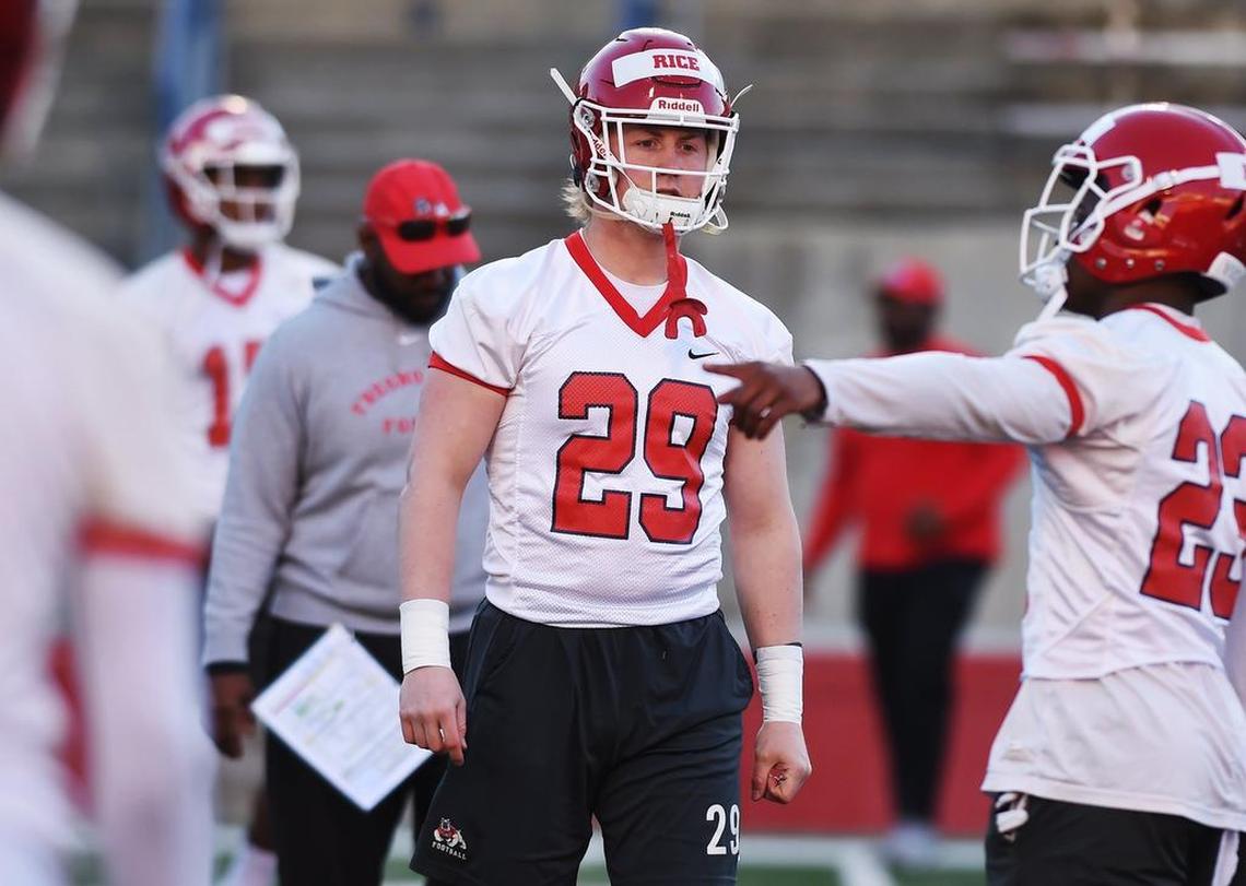 Fresno State linebacker Justin Rice, center, with defensive back Juju Hughes to the right, at the start of spring practice Monday morning, March 11, 2019 in Fresno.