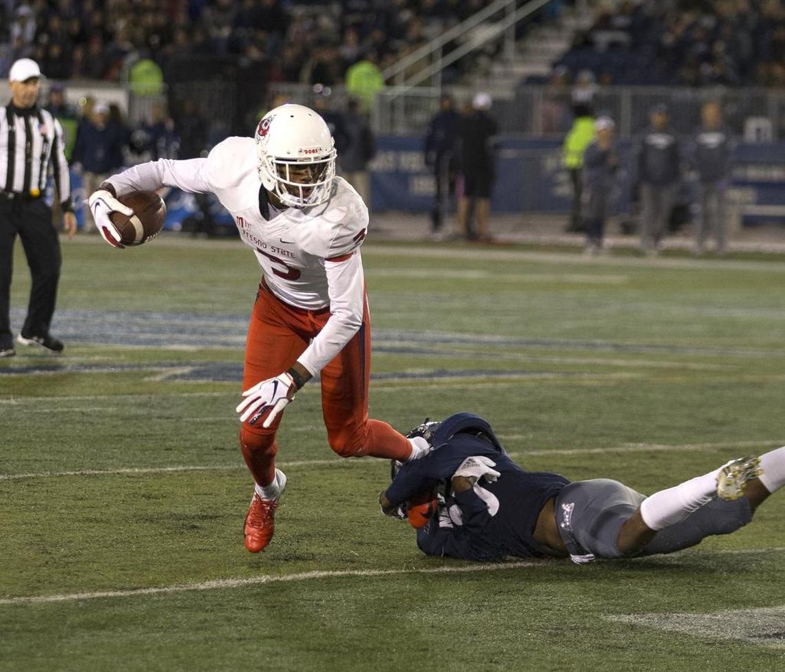 Fresno State wide receiver KeeSean Johnson gets away from Nevada’s Malik Reed in the first half. The senior wideout extended his streak to 41 consecutive games with at least one reception, the longest active streak in the nation.