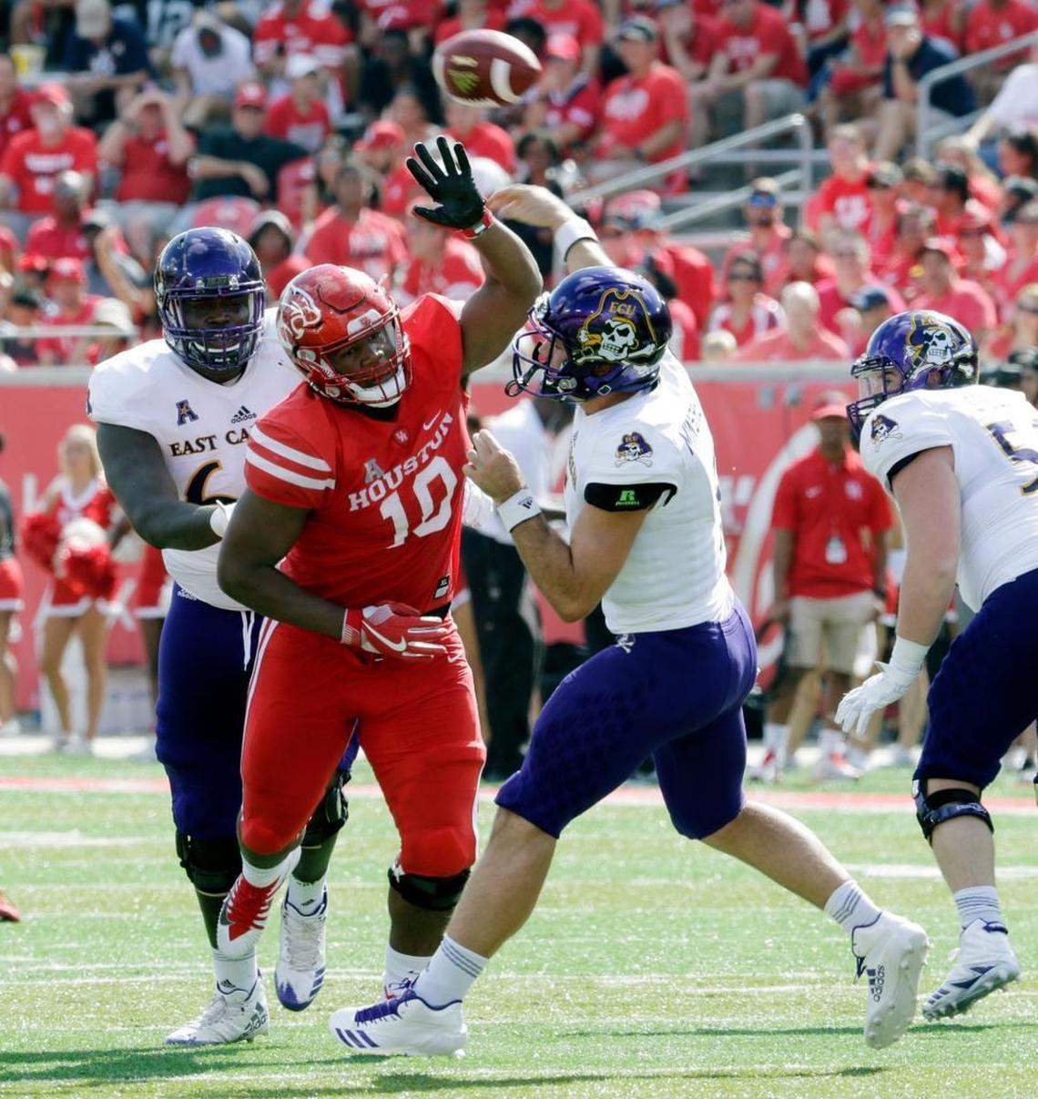 Houston defensive tackle Ed Oliver (10) tries to break up the pass by East Carolina quarterback Gardner Minshew (5) during the Cougars’ 52-27 victory on Saturday, Nov. 4, 2017, in Houston. Oliver, one of the best defensive linemen in the nation, has 37.5 tackles for loss in 24 career games.