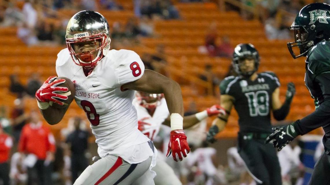 Fresno State wide receiver Da’Mari Scott runs into the end zone for one of his two second-quarter touchdowns Saturday at Hawaii.
