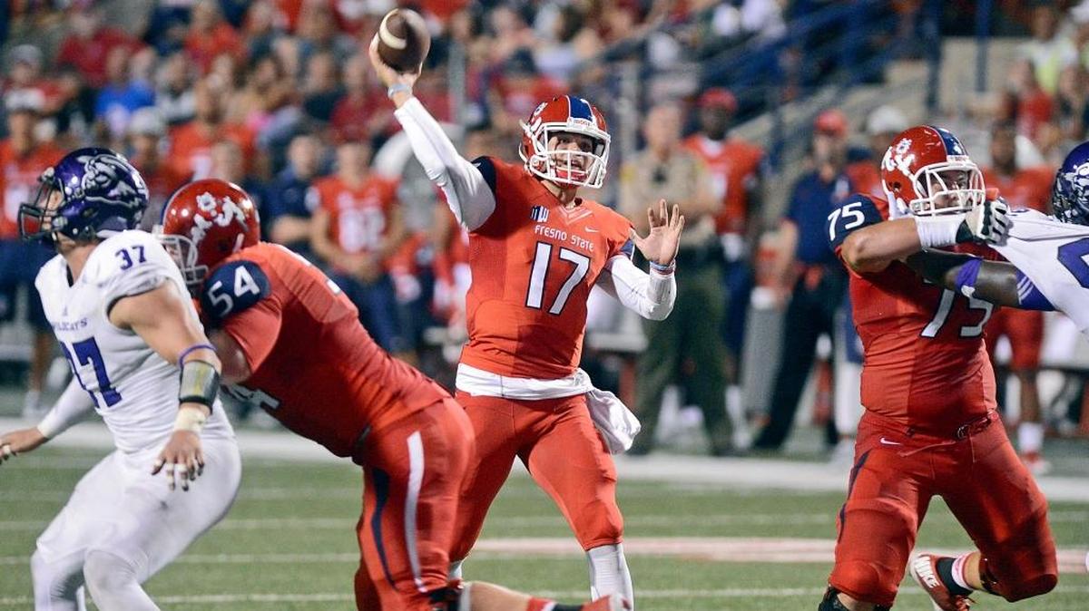 
Fresno State offensive linemen Justin Northern and Jacob Vazquez help maintain the pocket as Zack Greenlee looks downfield for a connection in the Bulldogs’ 34-13 season-opening victory over Abilene Christian on Sept. 3 at Bulldog Stadium.


