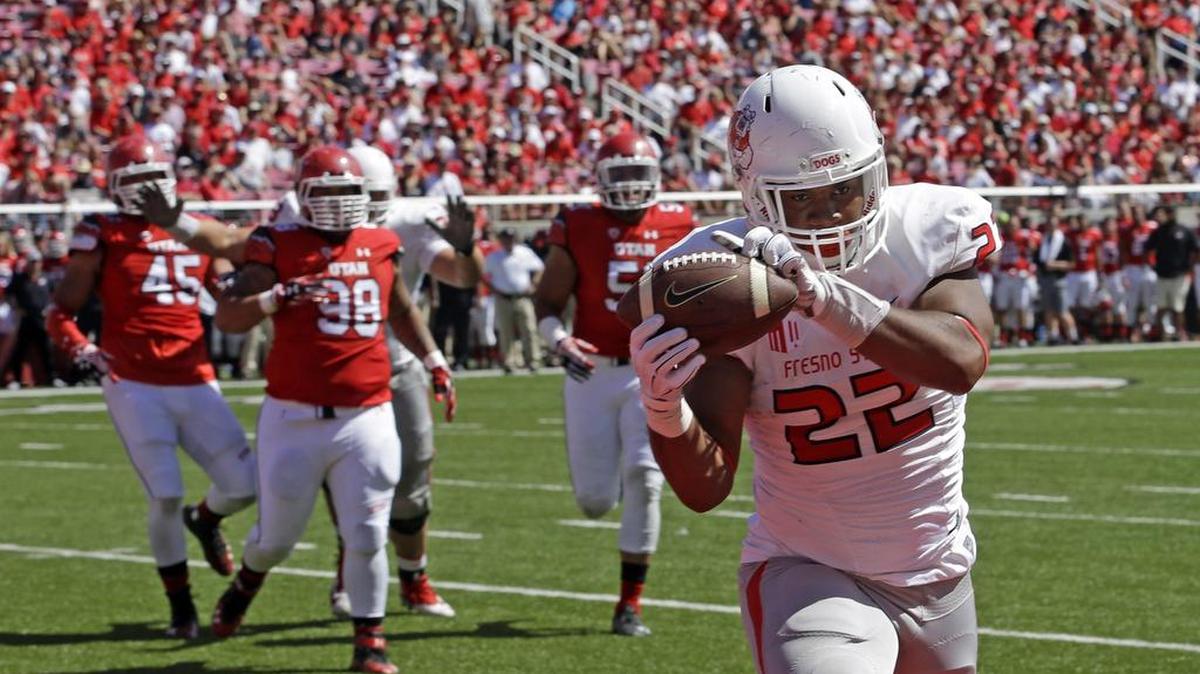 
Fresno State running back Malique Micenheimer hauled in this touchdown catch in the Bulldogs’ second game of the 2014 season against Utah but would suffer a season-ending shoulder injury the next week against Nebraska. 
