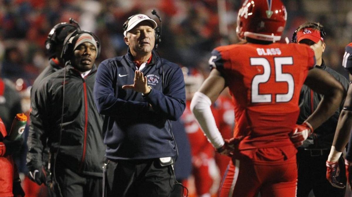 Fresno State coach Tim DeRuyter, shown instructing defensive back Tyquwan Glass during Saturday’s season-ending loss to Colorado State, will hit the road Monday to look for offensive talent.