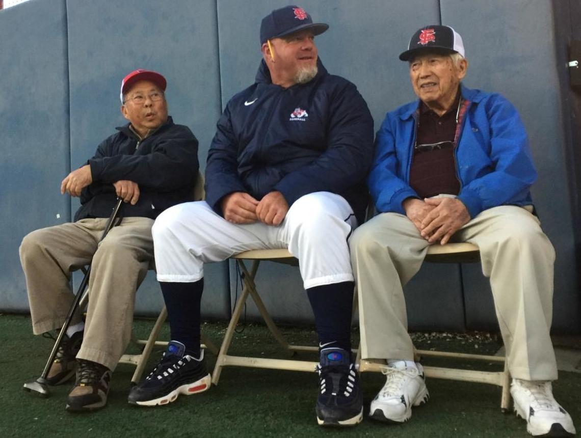 Former Bulldog baseball players Howard Zenimura (left) and Satoshi “Fibber” Hirayama (right) share some moments with Fresno State coach Mike Batesole ahead of Monday’s game against Oregon on Feb. 20, 2017. Fresno State honored Hirayama by retiring his No. 3 jersey number before the game.