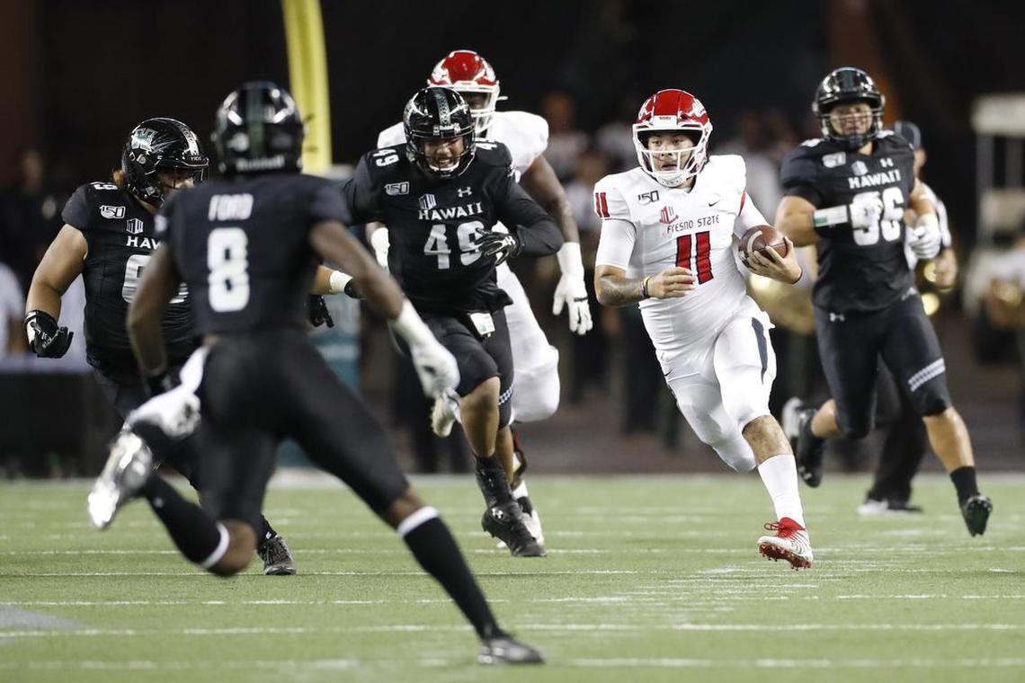 Fresno State quarterback Jorge Reyna (11) runs through the Hawaii defense in the Bulldogs’ 41-38 victory over the Rainbow Warriors Saturday, Nov. 2, 2019, in Honolulu. Reyna passed for 188 yards and one touchdown and had 96 rushing yards on 11 plays.