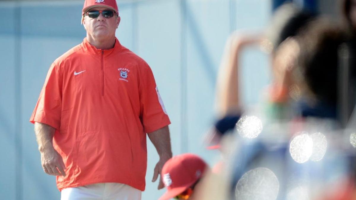 Fresno State coach Mike Batesole, walking along the dugout during the annual Alumni Game last week, got his 700th career win Saturday when the Bulldogs beat Creighton 2-1 at Beiden Field.