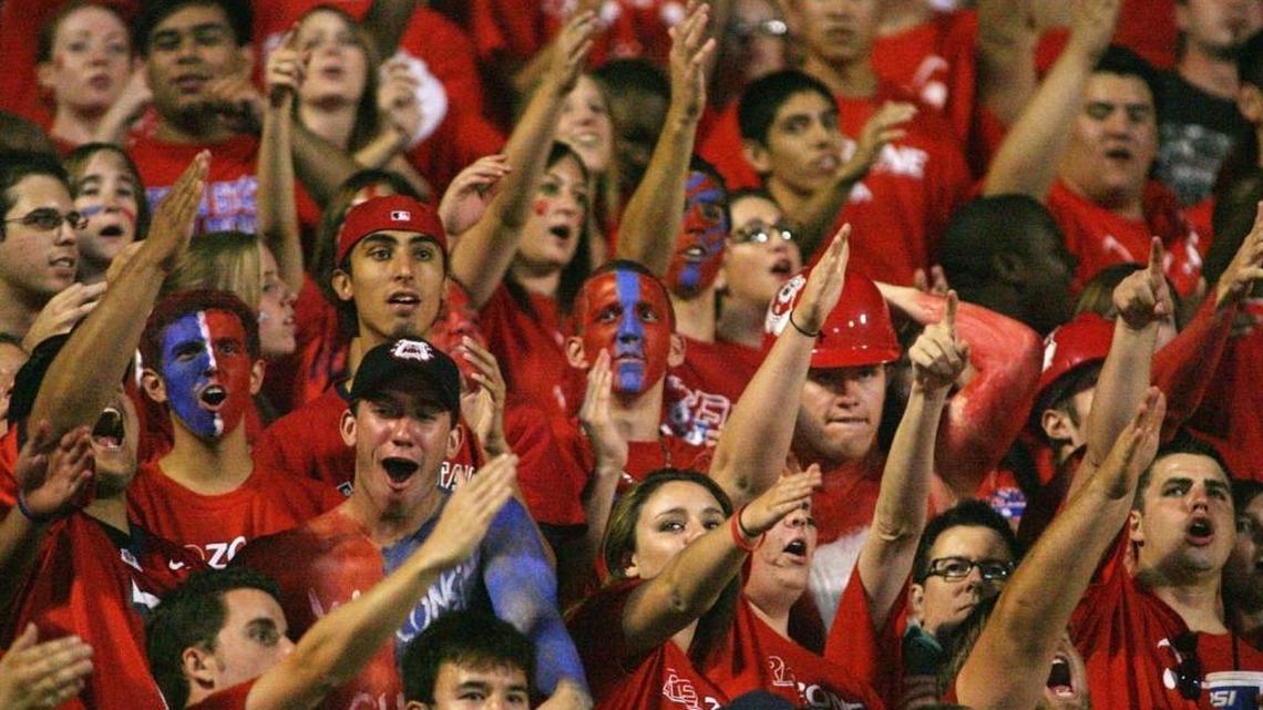 Fresno State fans roar as the Bulldogs enter the stadium for their 2008 home opener against Wisconsin. There were 42,387 at Bulldog Stadium for that game, but attendance at Fresno State football games has been slipping. This season, the Bulldogs averaged 25,493 for their six home games. Just two seasons before that they averaged 34,876.