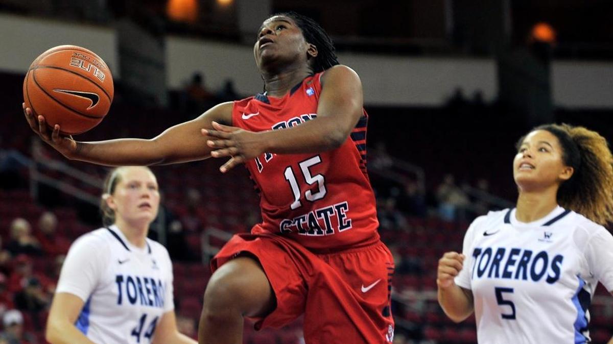 Fresno State’s Shauqunna Collins, center, goes for the layup against San Diego in a nonconference game earlier this season. Collins is averaging 10.8 points per game, scoring in double figures in nine of her 13 games.