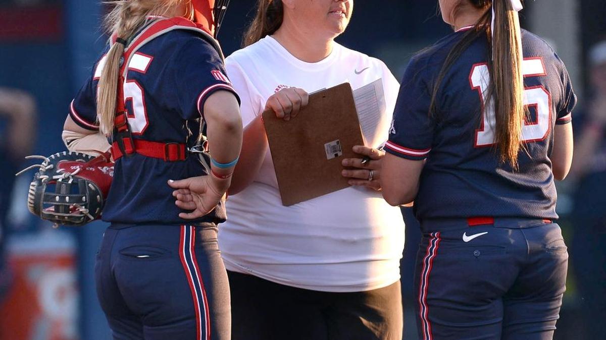 Fresno State coach Trisha Ford, center, meets with pitcher Hannah Harris and Paige Gumz in a Fresno Bee File photo. Ford and her coaching staff were named the NFCA’s Pacific Region Coaching Staff of the Year, after helping the Bulldogs to a 42-12-1 record and a second consecutive Mountain West title.