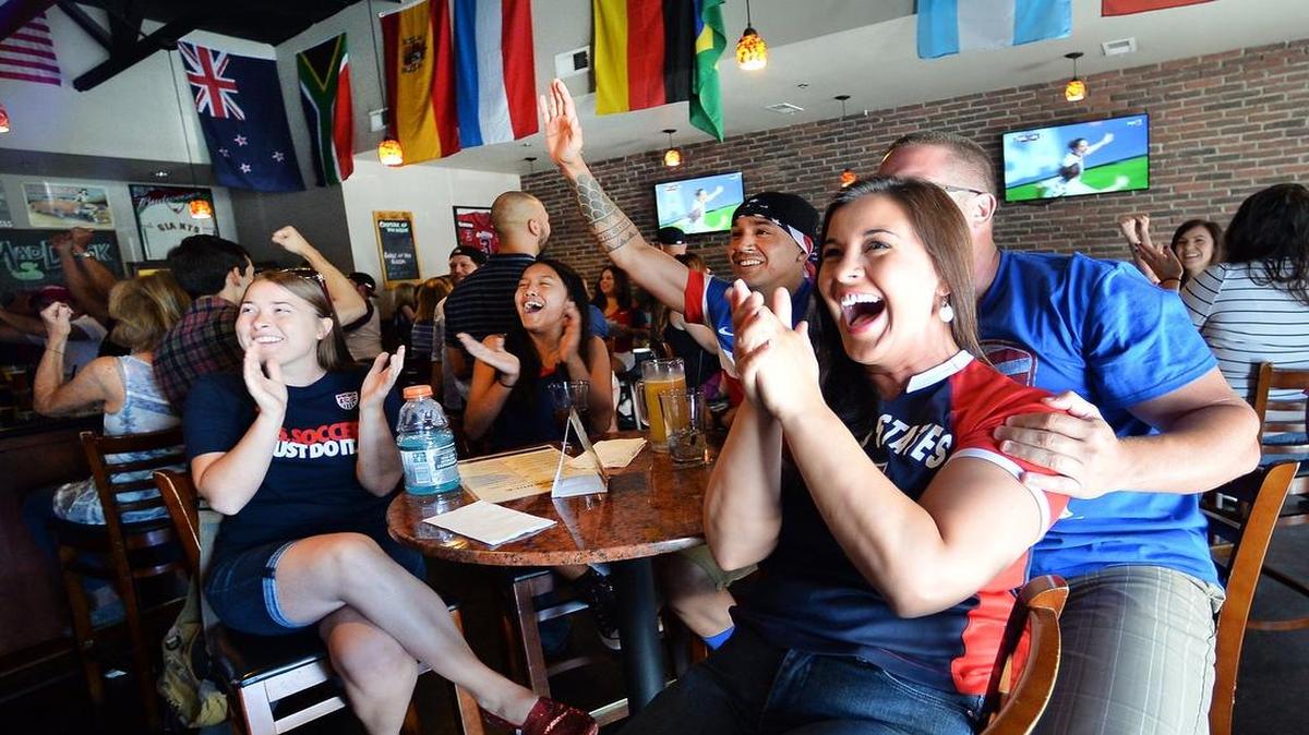 
From left, Lacie Wyrick, 24, Malia Mora, 13, Andriz Mora, 37, Christian Carlson, 30, and Jennifer Trevino, 30, all of Clovis, watch the U.S.-Japan Women’s World Cup final at The Mad Duck in Clovis, California, on July 5, 2015.
