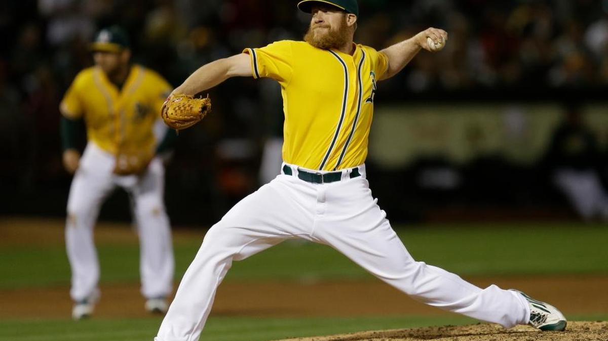 Oakland Athletics pitcher Sean Doolittle works against the Los Angeles Angels during the eighth inning of a baseball game Friday, June 17, 2016, in Oakland. Doolittle is on the disabled list, but still made the day of a young fan on Monday.