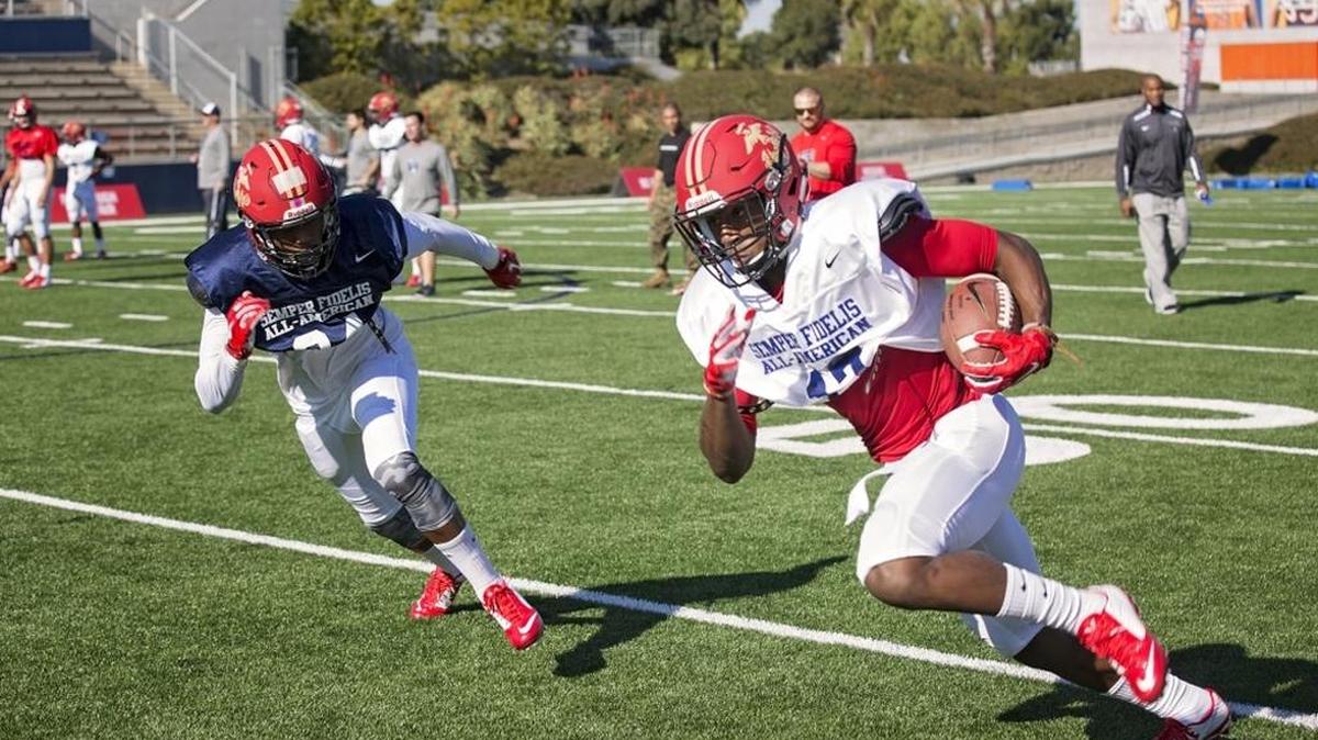 Darian Owens, wide receiver from Clovis West High, runs with the football after making a catch during a Dec. 30, 2015, practice at Orange Coast College ahead of the Semper Fidelis All-American Bowl. High school athletes chosen to play in the game, according to organizers, are well-rounded individuals on and off the field who not only are distinguished athletes but also have academic achievements and display exemplary moral characteristics.