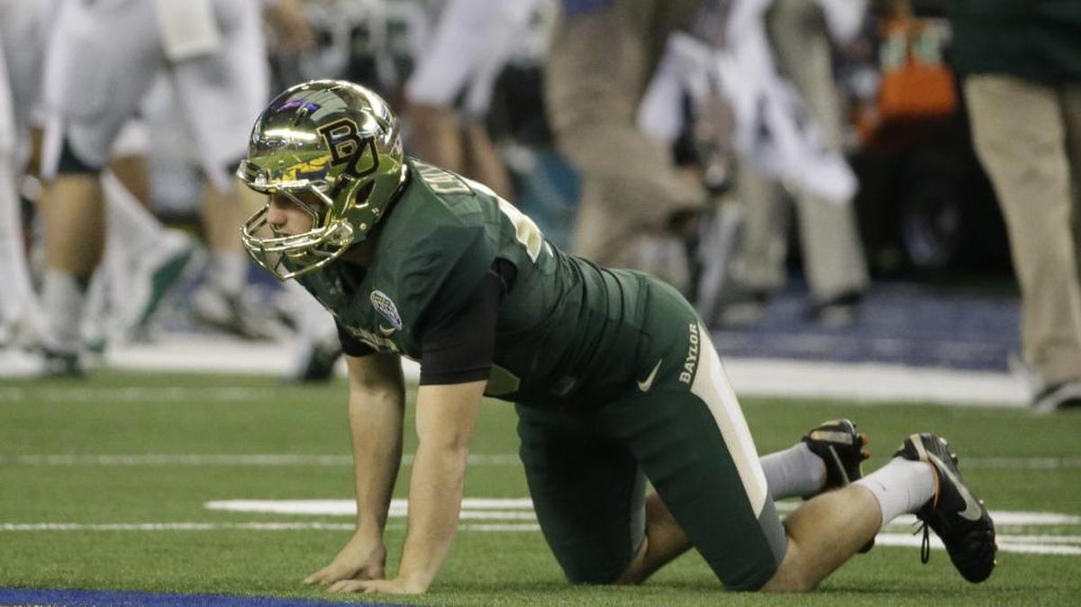 Baylor kicker Chris Callahan rests on the turf after his missed field goal attempt during the second half of the Cotton Bowl against Michigan State on Jan. 1, 2015, in Arlington, Texas.