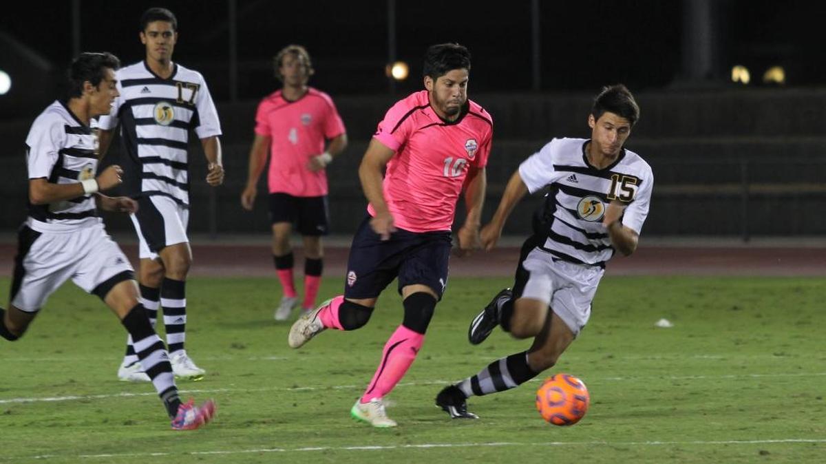 Fresno Pacific senior captain Renato Bustamante, center, was named the PacWest Conference Player of the Year on Wednesday after leading the league in points (31) and assists (13). On Thursday, the Sunbirds lost 3-2 to Cal State Dominguez Hills and were eliminated in the first round of the NCAA D-II Championship Tournament.
