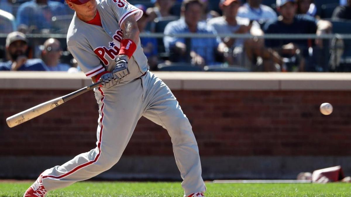 Philadelphia Phillies’ A.J. Ellis hits a two-run double during the seventh inning of a baseball game against the New York Mets, Sunday, Aug. 28, 2016, in New York.