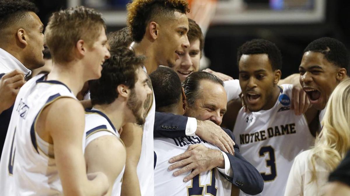 Notre Dame head coach Mike Brey embraces guard Demetrius Jackson (11) after Notre Dame defeated Stephen F. Austin 76-75 in a second-round NCAA men’s college basketball tournament game Sunday, March 20, 2016, in New York.