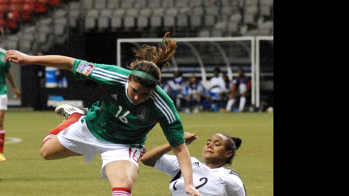 
Anisa Guajardo (14) battles for the ball during Mexico’s 7-0 win over the Dominican Republic during their match at the 2012 CONCACAF Women’s Olympic Qualifying Tournament. The 24-year-old striker from Fresno was announced as a late addition for Mexico in the Women’s World Cup.
