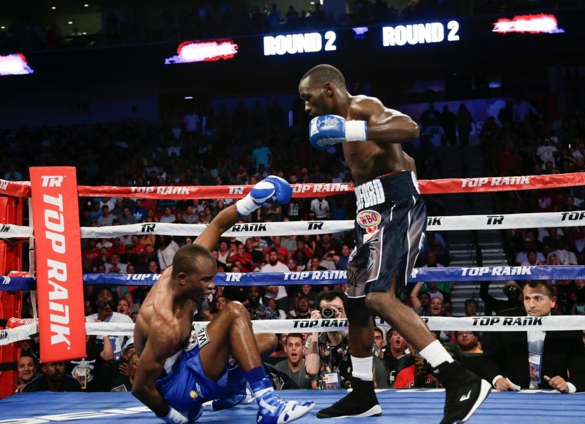 Terence Crawford stands over Julius Indongo after a punch brought him down in the second round of the August 2017 junior welterweight world title unification bout in Nebraska. Crawford won by knockout during the third round.